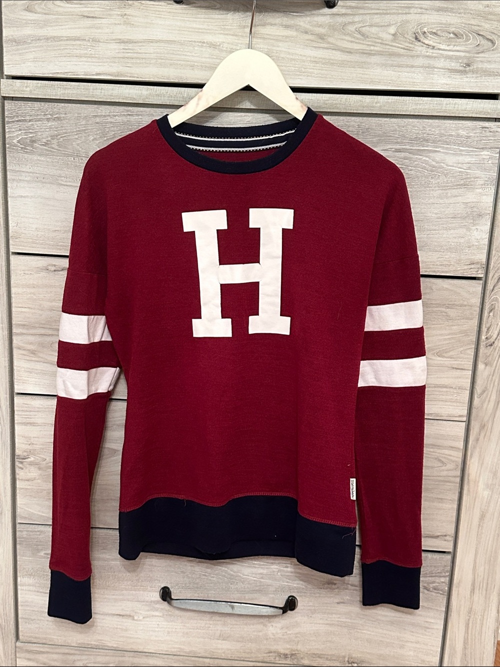 Burgundy Crewneck Sweater with White 'H' and Stripe Accents